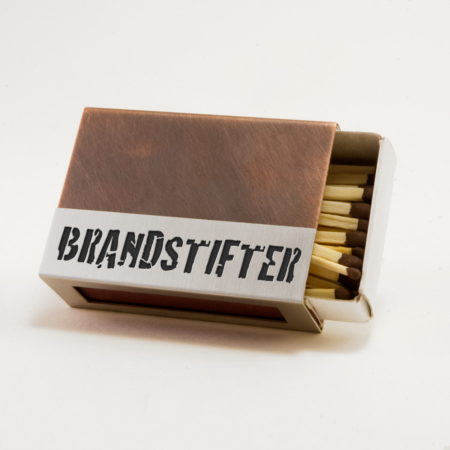 Streichholzschachtel - Huelle "Brandstifter" aus Edelstahl und Kupfer mit schwarzer Schrift