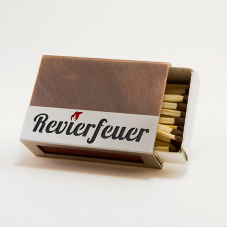 Streichholzschachtel - Huelle "Revierfeuer" aus Edelstahl und Kupfer mit schwarzer Schrift