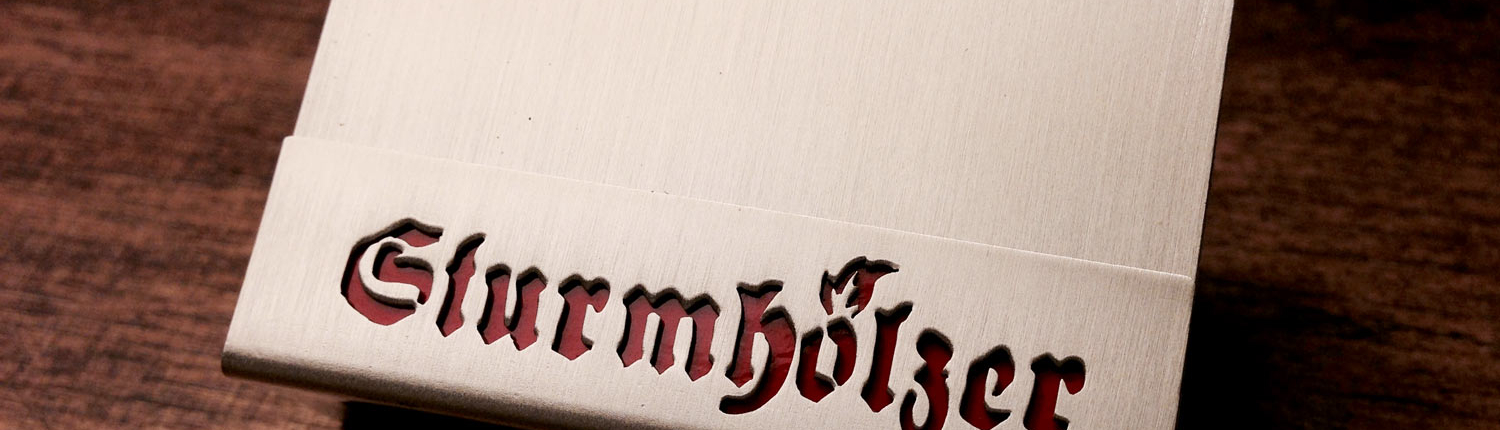 Hülle für Streichholzschachteln mit dem Schriftzug "Sturmhölzer"