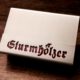 Hülle für Streichholzschachteln mit dem Schriftzug "Sturmhölzer"