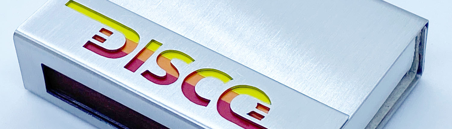 Streihholzschachte-Etui mit ausgesägtem Schriftzug "DISCO"